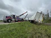 Employees with PJ's Towing haul toppled semi-trucks off both lanes of I-96 near Williamston in the early morning hours of Friday, Aug. 25, after a tornado touched down in Ingham County late Thursday, Aug. 24 (Photos courtesy of PJ Daly).