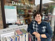 Africa Schaumann poses in front of Dawn Treader Book Shop at 514 E. Liberty St. in Ann Arbor.