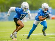 Detroit Lions wide receiver Trinity Benson, left, chases after teammate Kalif Raymond during a drill on Wednesday, July 27, 2022 as the Detroit Lions open 2022 training camp at the team's facility in Allen Park. (Jake May | MLive.com)